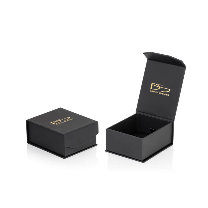 Black Daniel Steiger branded jewelry boxes, one closed and one open, designed for packaging Brilliant Birthstones Earrings July in sterling silver with rhodium plating.