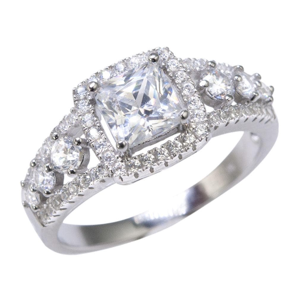 Aria Ring featuring a sterling silver band with rhodium plating, showcasing a princess-cut center stone surrounded by smaller round stones for a dazzling feminine jewelry piece.