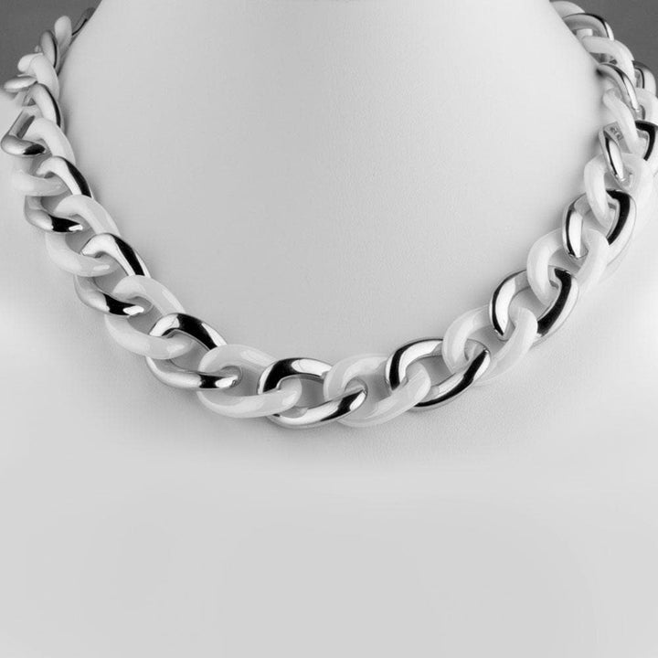 Ceramica White Necklace featuring an elegant chain design with alternating white and silver links, perfect jewelry accessory for women.