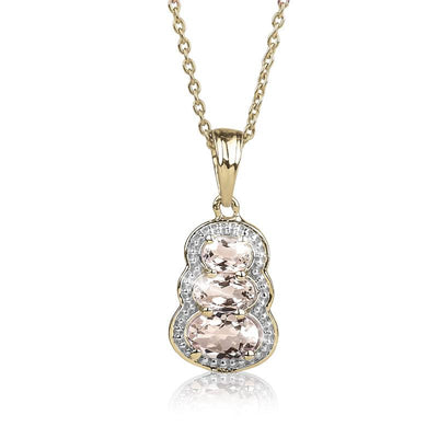 Liberty Morganite Pendant featuring three oval morganite stones set in a delicate gold chain with a sparkling diamond halo, designed for women’s jewelry collections.