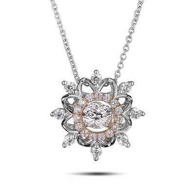 Dancing Snowflake Pendant in sterling silver with two-tone plating, featuring a sparkling snowflake design with clear stones, elegantly crafted for women’s jewelry.