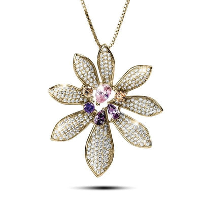 Ayana Flower Pendant featuring a delicate flower design with sparkling clear and colored gemstones set in gold, crafted for women as a statement jewelry necklace.