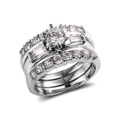 Trina Ring featuring sterling silver with rhodium plating, designed for female jewelry lovers, showcasing a sparkling center stone surrounded by smaller round and baguette-cut stones.