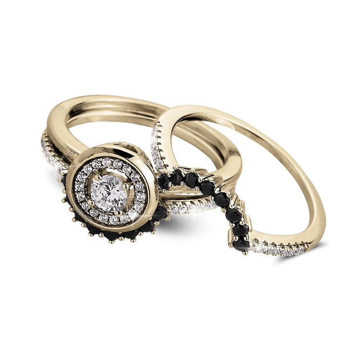 Trio Halo Ring set in sterling silver with gold plating, featuring a round center stone surrounded by a halo of smaller clear and black stones, designed for women’s jewelry.
