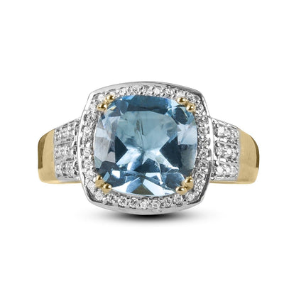 Grace Blue Topaz Ring featuring a sterling silver band plated in gold with a cushion-cut blue topaz center stone surrounded by sparkling accents, designed for female jewelry collectors.
