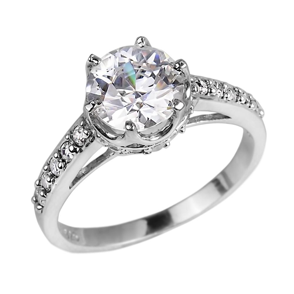 Sterling silver Crown Ring for female with rhodium plating featuring a large clear round center stone and smaller stones along the band, elegant jewelry ring design.
