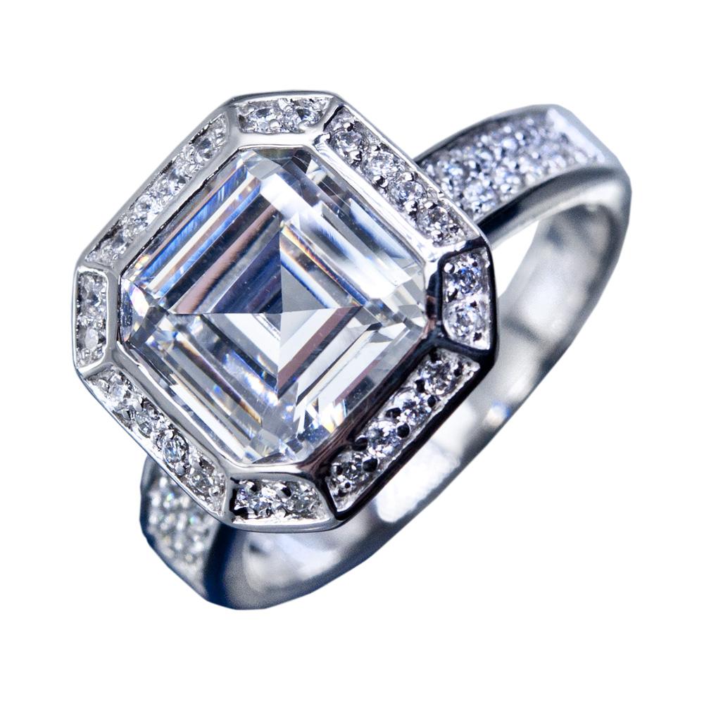Asscher Deco Ring featuring a sterling silver band with rhodium plating, adorned with a large square-cut center stone surrounded by smaller sparkling stones, elegant women's jewelry ring.
