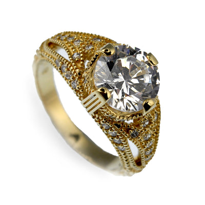 Eldorado Ring crafted in sterling silver with gold plating, featuring an intricate design and a large sparkling centerpiece stone, designed for women’s jewelry collections.