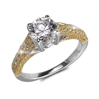 Davina Ring featuring a two-tone sterling silver band with a sparkling round-cut center stone, designed for women seeking elegant and timeless jewelry.
