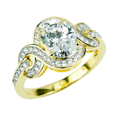 Isola Ring featuring a sterling silver band with gold plating, adorned with a large central gemstone and intricate diamond accents, designed for women.