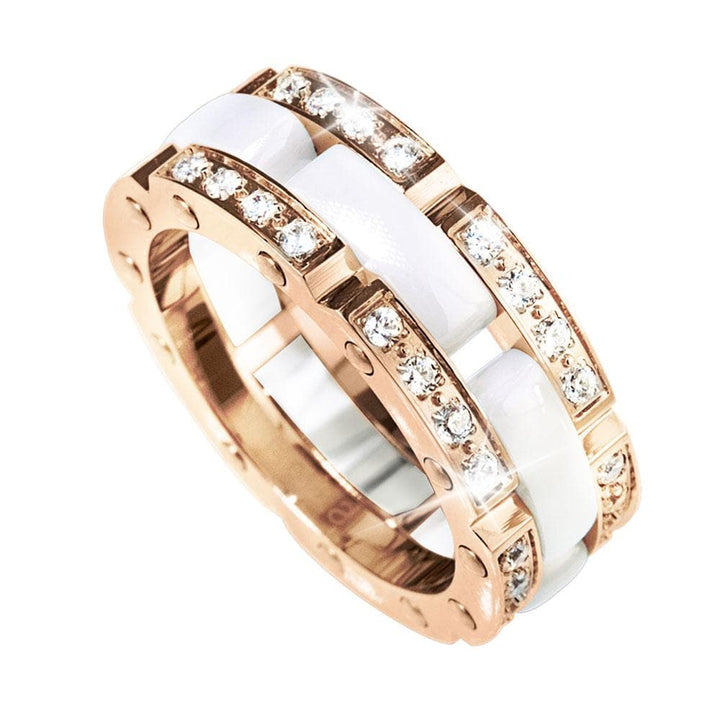 Close-up view of a female Java Ceramic Perfection Ring featuring ceramic material and rose gold plating with sparkling embedded crystals, elegant jewelry design.