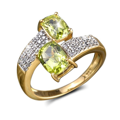 Peridot Hug Ring featuring two cushion-cut peridot stones set in sterling silver with gold plating and accented by sparkling clear crystals, designed for women’s jewelry collection.