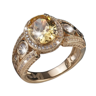Shangri-La Yellow Ring featuring a gold-plated sterling silver band with a large yellow gemstone center surrounded by smaller clear stones, designed for female jewelry collectors.