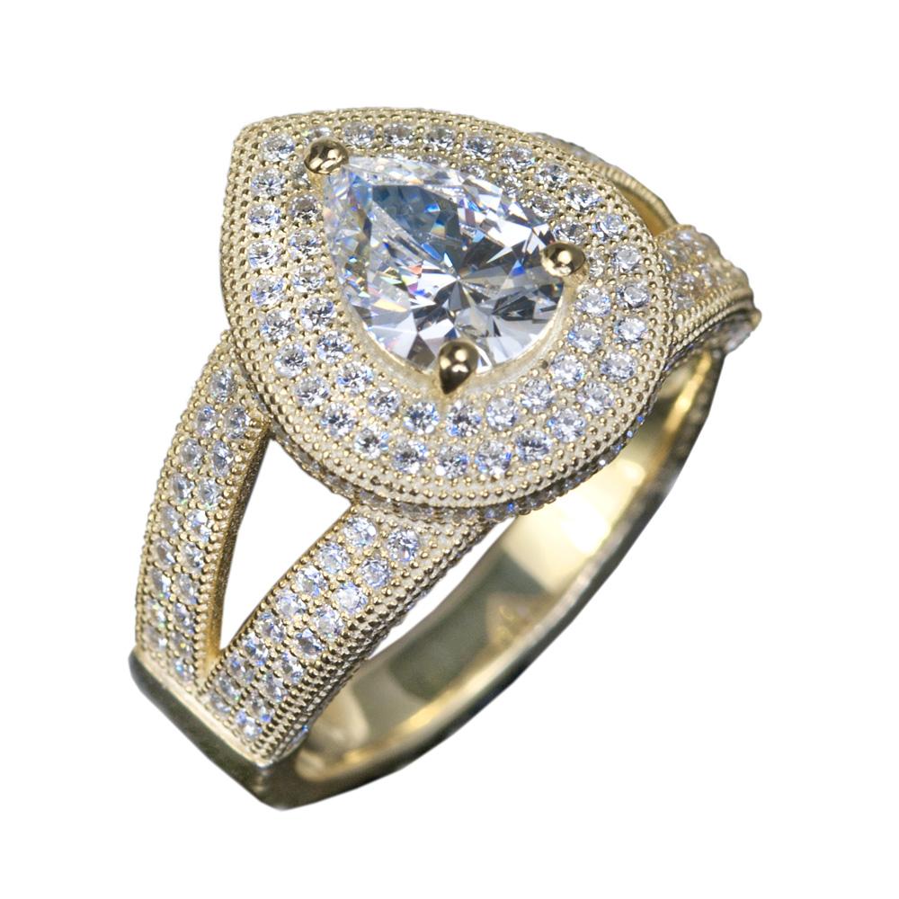 Elegant Cullinan Ring for female, crafted in sterling silver with gold plating, featuring a pear-shaped center stone surrounded by sparkling smaller stones in a split shank design.