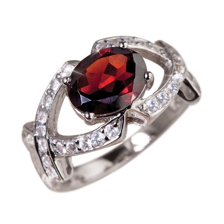 Rioja Garnet Ring featuring a deep red garnet centerpiece set in sterling silver with sparkling accent stones, designed for women’s jewelry collections.