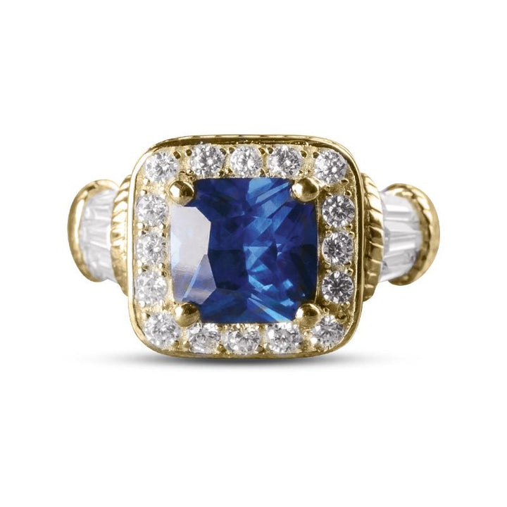 Princesa Azul Ring featuring a sterling silver band with a large blue gemstone centerpiece surrounded by sparkling clear stones, designed for women’s jewelry.