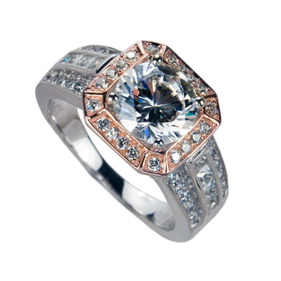 Piazza Ring featuring a large central gemstone set in a two-tone sterling silver band adorned with smaller sparkling stones, designed for female jewelry enthusiasts.