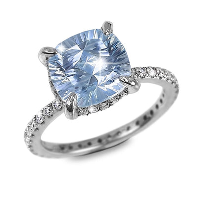 Trillion Topaz Ring featuring a sparkling trillion-cut blue topaz centerpiece set in sterling silver with rhodium plating, designed for women’s jewelry collections.