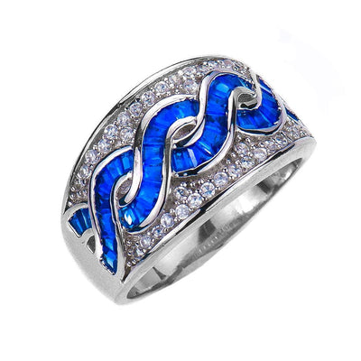 Charleston Ring featuring sterling silver with rhodium plating, embellished with vibrant blue stones and clear sparkling accents, designed for women’s jewelry collections.