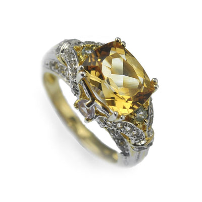 Antoinette Citrine Ring featuring a large faceted citrine gemstone set in sterling silver with two-tone plating, designed as an elegant female jewelry piece.