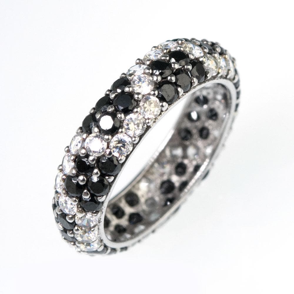 Elegant Zigzag Ring crafted in sterling silver with rhodium plating, featuring alternating rows of black and clear gemstones for a striking, sophisticated jewelry piece for women.